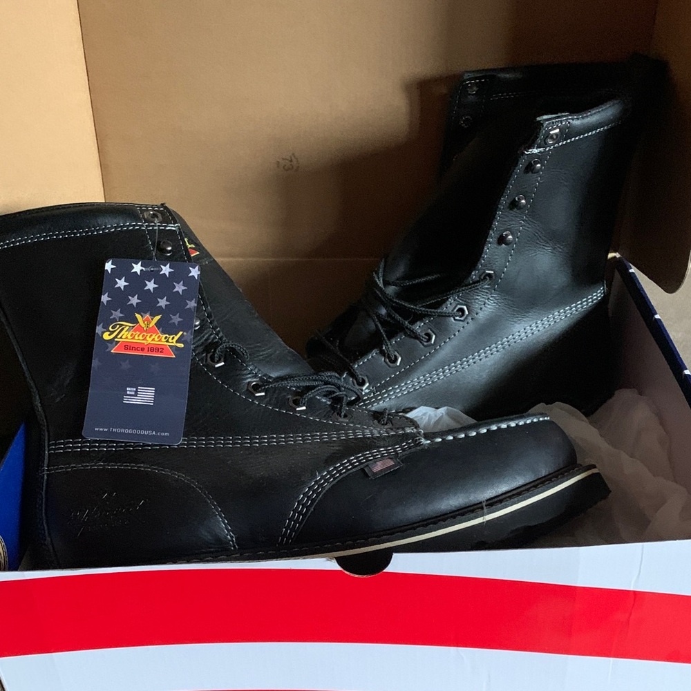 Black leather Thorogood Men’s Boot.  Made in the USA. Steel toe wedge sole.